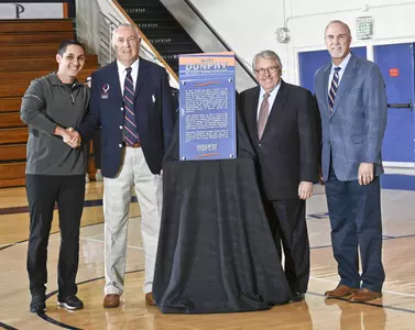 Marv Dunphy, David Hunt, President Andrew Benton, Director of Athletics Steve Potts (Photo by Martin A. Folb)