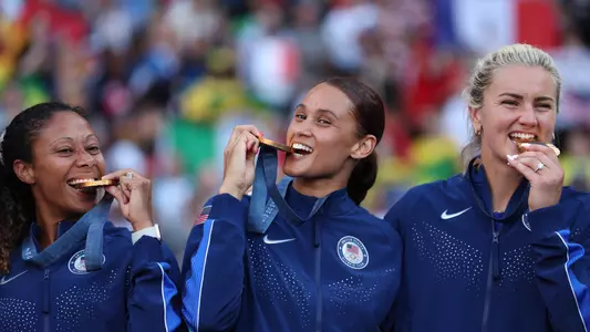 PARIS, FRANCE - AUGUST 10: (L-R) Casey Krueger, Lynn Williams and Lindsey Horan #10 of Team United States pose for a photo after the Women's Football Medal Ceremony during the Olympic Games Paris 2024 at Parc des Princes on August 10, 2024 in Paris, France. (Photo by Justin Setterfield/Getty Images)