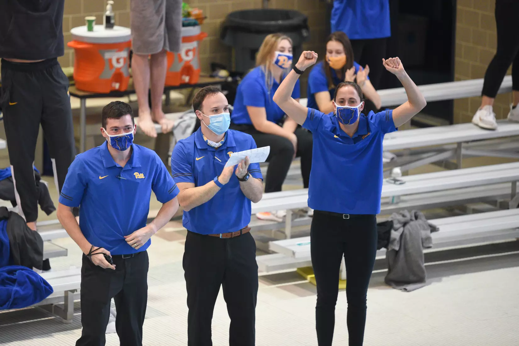 Associate head coach Dr. Marc Christian (center) and assistant coaches Trevor Carroll (left) and Kristen Murslack (right)