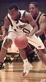 Brandin Knight drives to the hoop ahead of Indiana-Purdue-Indianapolis' Taj Hawkins in the first half.