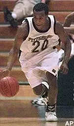 Brandin Knight dribbles by a defender after making a steal in the first half of the 92-59 Panther win.