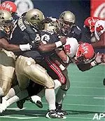 Pittsburgh defenders hold <br>Rutgers' Jason Ohene <br>to a 4-yard rush <br>in Sat. 25-21 loss.