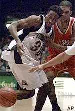 Derrick Worrell and Syracuse's Kelli Taylor vie for a loose ball in first half action Wednesday.