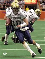 Pittsburgh quarterback John Turman breaks from the pocket and scrambles for a touchdown during the first quarter.