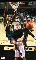 Pittsburgh's Isaac Hawkins dunks the ball during the second half of Sunday's battle against VCU. Isaac led the Panthers with a season-high 21 points.