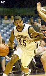 Pittsburgh's Ricardo Greer, left, drives to the basket against Robert Morris' Wesley Fluellen during the first half.