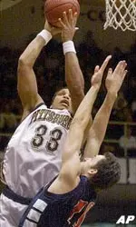 Chris Seabrooks shoots over a St. Francis of New York player during the first half in Pittsburgh.