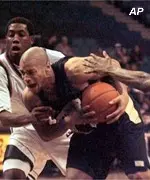 Jarrett Lockhart drives past two Miami defenders in first-half action Tuesday night.