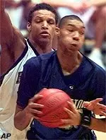 Chris Seabrooks reaches in for a steal on Georgetown's Lee Scruggs during the first half of Sunday's game.