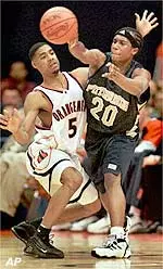 Pittsburgh's Brandin Knight passes off under pressure from Syracuse 's Jason Hart in first half action Wednesday.