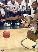 Ricardo Greer fights off Miami's Vernin Jennings to get to the ball.