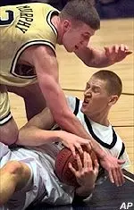 Donatas Zavackas fights with the Irish's Troy Murphy for a loose ball during the Panthers victory Saturday.