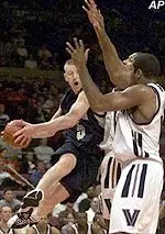 Pittsburgh's Donatas Zavackas takes to the air against two Villanova defenders during first round action Wednesday.
