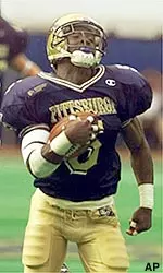 Pittsburgh kick returner Torrie Cox sprints away from Rutgers defenders to return a second quarter kickoff 85 yards for a touchdown.