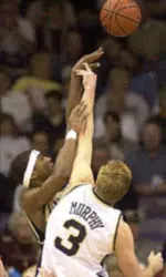 Pittsburgh guard Julius Page (1) puts a shot up over Notre Dame forward Troy Murphy (3) during action Tuesday Jan. 16, 2001 in South Bend, Ind. (AP Photo/Joe Raymond)
