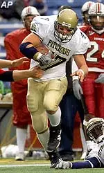 Defensive end Brian Guzek gets past a Temple player on his way to an 80-yard touchdown run after stripping Temple running back Tanardo Sharps of the ball in the fourth quarter.