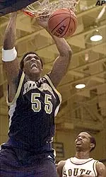 Toree Morris dunks over South Florida's Gerrick Morris in the first half of the championship game of the University Hoops Classic.