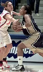 Pittsburgh's Jackie Campbell, right, looks to pass despite the defense of Wisconsin's Kyle Black (32) during the first half.