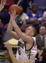 Pittsburgh's Donatas Zavackas shoots over Duquesne's Tyler Bluemling, bottom, in the second half in Pittsburgh, Saturday.