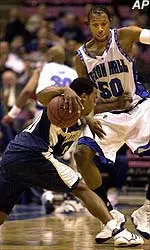 Pittsburgh's Brandin Knight attempts to get by the defense of Seton Hall's Greg Morton during the first half Thursday.