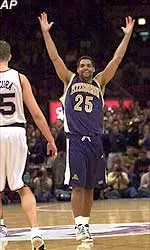 Pittsburgh's Ricardo Greer walks past Notre Dame's Jere Macura as Greer starts to celebrate their 66-54 upset victory in the quarterfinal round of the Big East tournament Thursday.