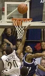 Villanova's Gary Buchanan misses the block as Pittsburgh's Brandin Knight shoots in the first half.