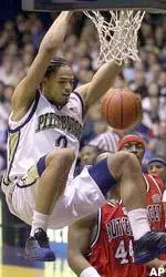 Pittsburgh's Chevon Troutman, left, dunks over Rutgers' Rashod Kent in the second half.
