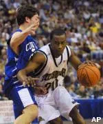 Brandin Knight drives past Jon Popofski during Pittsburgh's 71-54 win Friday.