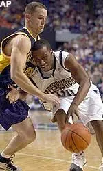 Brandin Knight tries to work the ball against Kent State's Trevor Huffman during the first half of their NCAA South Regional semifinal game at Rupp Arena in Lexington, Ky.