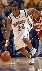 Pittsburgh's Brandin Knight rives down court as Boston College's Jermaine Watson chases during game action at the Big East basketball tournment Thursday.