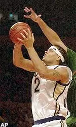 Pittsburgh's Chevon Troutman shoots the ball and is fouled by Miami's Rafael Berumen during game action at the Big East men's basketball tournment Friday.
