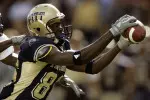 Pittsburgh wide receiver Greg Lee (86) catches a long pass in front of South Florida defensive back Mike Jenkins to the three-yard line, setting up a Pittsburgh touchdown in the second quarter in Pittsburgh on Saturday, Oct. 15, 2005. (AP Photo/Keith Srakocic)