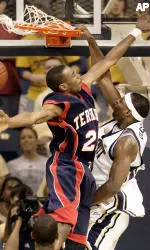 John DeGroat gets behind St. Francis, N.Y's Devon Neckles for a dunk in the second half. (AP Photo/Keith Srakocic)