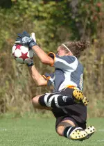 Pitt goalkeeper Jamie Pelusi makes a diving save.