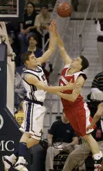 Levon Kendall blocks a shot by Wisconsin's Jason Chappell during the first half.