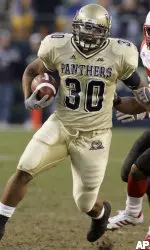 Pittsburgh's running back Conredge Collins makes a big gain in front of Louisville safety Brandon Sharp, right, in the second quarter of the football game in Pittsburgh, Saturday, Nov. 25, 2006. (AP Photo/Keith Srakocic)