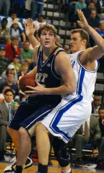 Center Aaron Gray, left, looks toward the basket