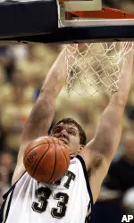 Pittsburgh's Aaron Gray dunks the ball in the first half of the Big East basketball game against Cincinnati in Pittsburgh on Sunday, Feb. 12, 2006. (AP Photo/Keith Srakocic)