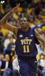 Carl Krauser reacts after hitting a three-pointer against Marquette in the first half. (AP Photo/Darren Hauck)