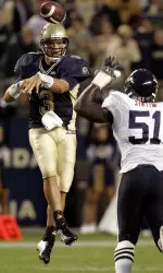 Tyler Palko throws a pass over Clint Sintim in the first half. (AP Photo/Keith Srakocic