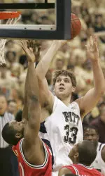 Aaron Gray shoots two of his thirteen over St. John's Aaron Spears.