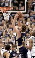 Aaron Gray drives to the basket followed by Villanova's Will Sheridan during the first half. (AP Photo/Tom Mihalek)