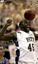 DeJuan Blair, who finished with 16 points, smiles after dunking in front of Saint Louis' Kevin Lisch in the first half.