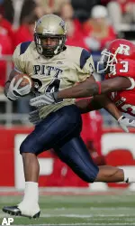 LaRod Stephens-Howling fights the grasp of Rutgers' defensive back Ron Girault in the second quarter at Rutgers Stadium in Piscataway, N.J. Saturday. (AP Photo/Rich Schultz)
