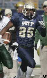 LeSean McCoy runs past South Florida linebacker Tyrone McKenzie for a long gain after catching a screen pass in the first quarter. (AP Photo/Keith Srakocic)