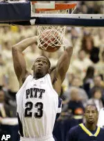 Sam Young goes up for a dunk in front of Toledo's Anthony Byrd in the first half. (AP Photo/Keith Srakocic)