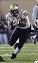 Freshman running back LeSean McCoy, who finished with 148 rushing yards, looks for a hole to run through against West Virginia during the first half.