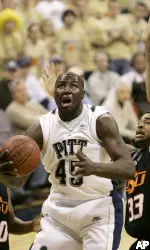 DeJuan Blair goes to the basket as Oklahoma State's Marshall Moses defends in the first half. (AP Photo/Keith Srakocic)