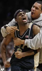 Levance Fields celebrates with a teammate after hitting the game-winning shot.