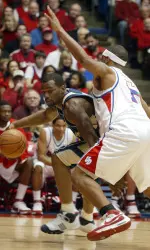 Pittsburgh's Sam Young (23) tries to drive past the defense of Dayton's Charles Little during the first half